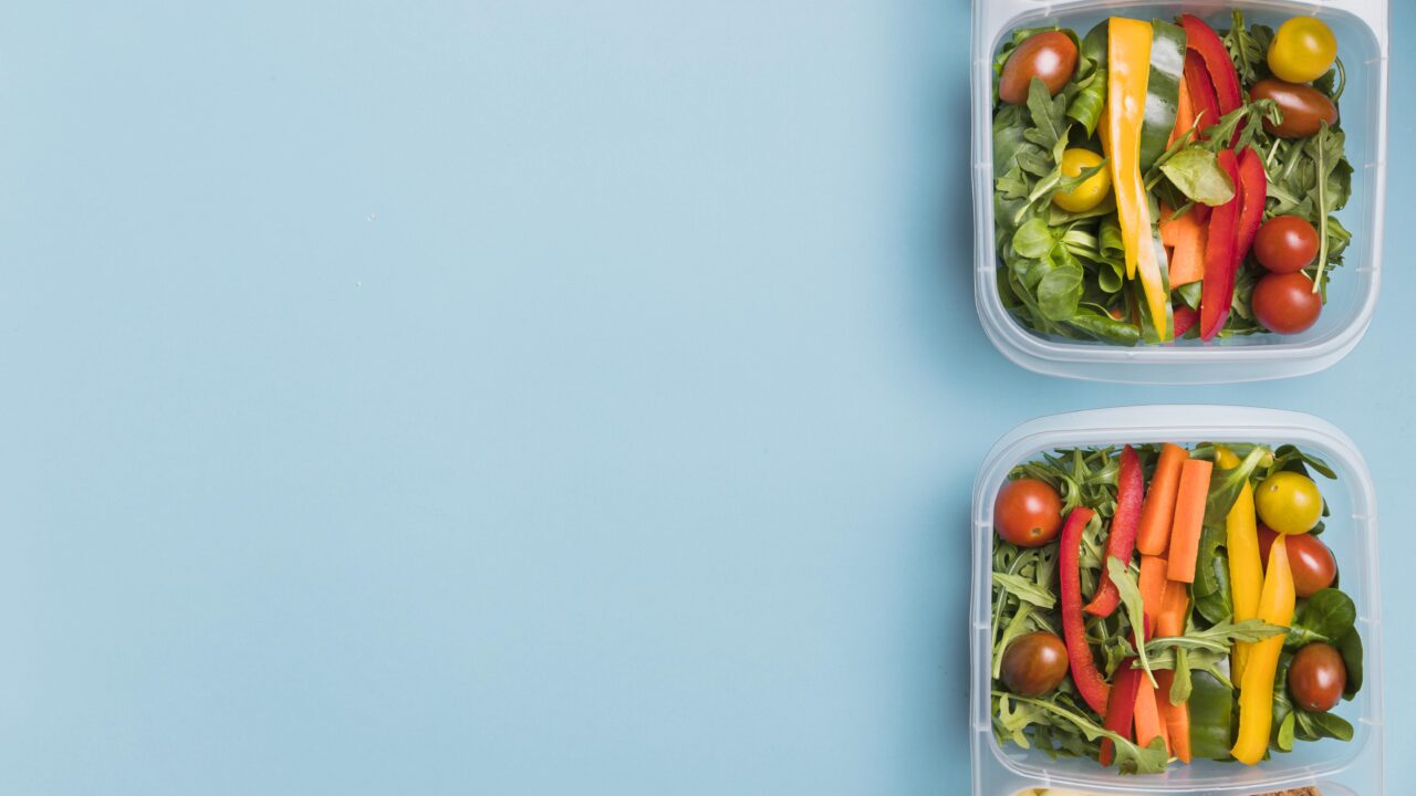 Two matching meal prep lunchboxes arranged flat lay, ready for a couple's weekly meal prep