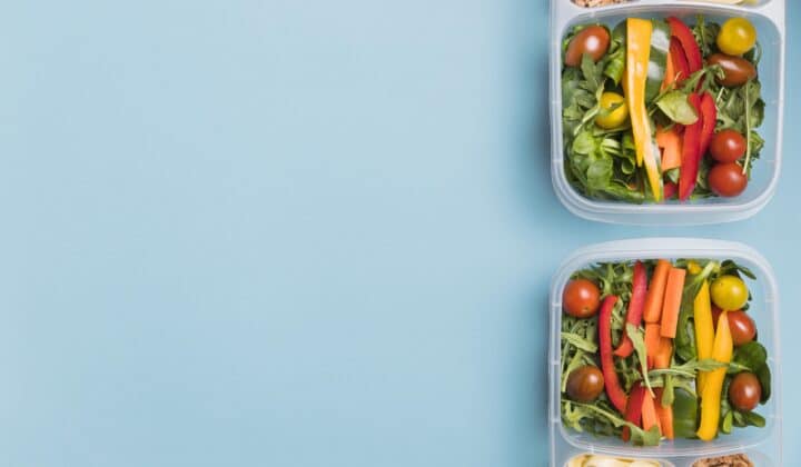 Two matching meal prep lunchboxes arranged flat lay, ready for a couple's weekly meal prep