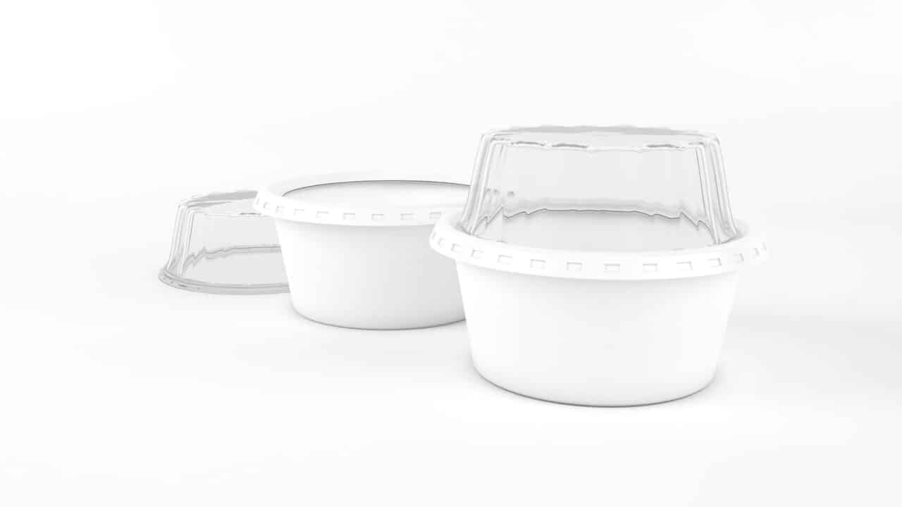 Stack of empty white plastic meal prep containers with clear airtight lids