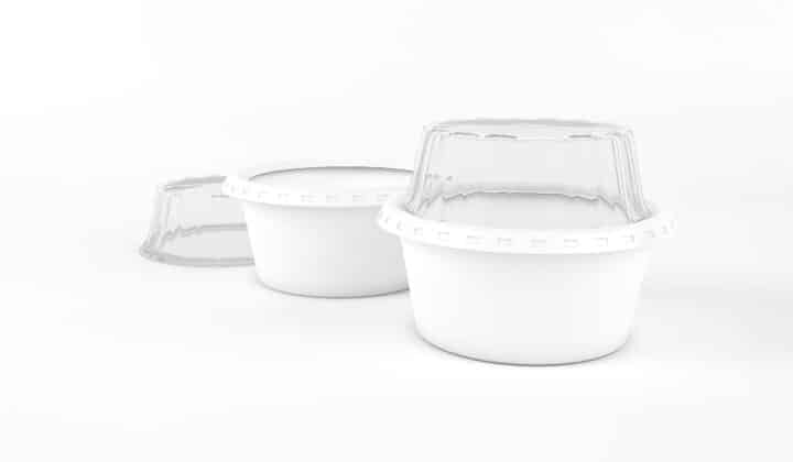 Stack of empty white plastic meal prep containers with clear airtight lids