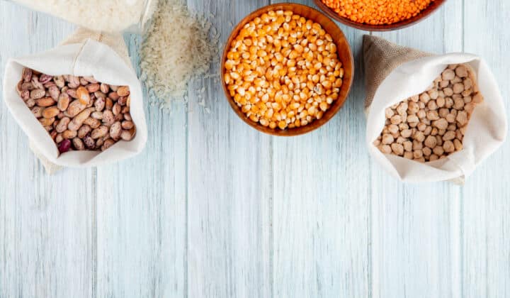 Bowls of dried beans, rice, lentils and chickpeas, the cheapest meal prep staples