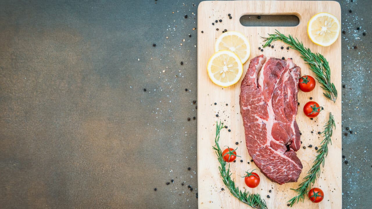 Raw beef meat on a cutting board