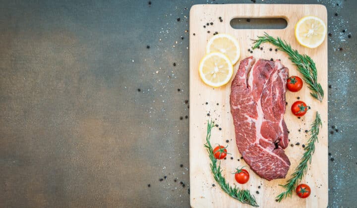 Raw beef meat on a cutting board