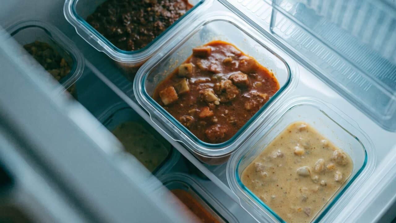 Homemade cooked meals stored in containers in the fridge