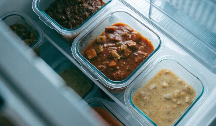 Homemade cooked meals stored in containers in the fridge