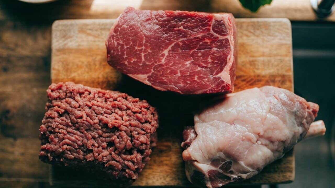 Assortment of raw meats on a cutting board